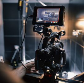 Behind the scenes of filming films or video products and the film crew of the film crew on the set in the pavilion of the film studio. Video Production Concept